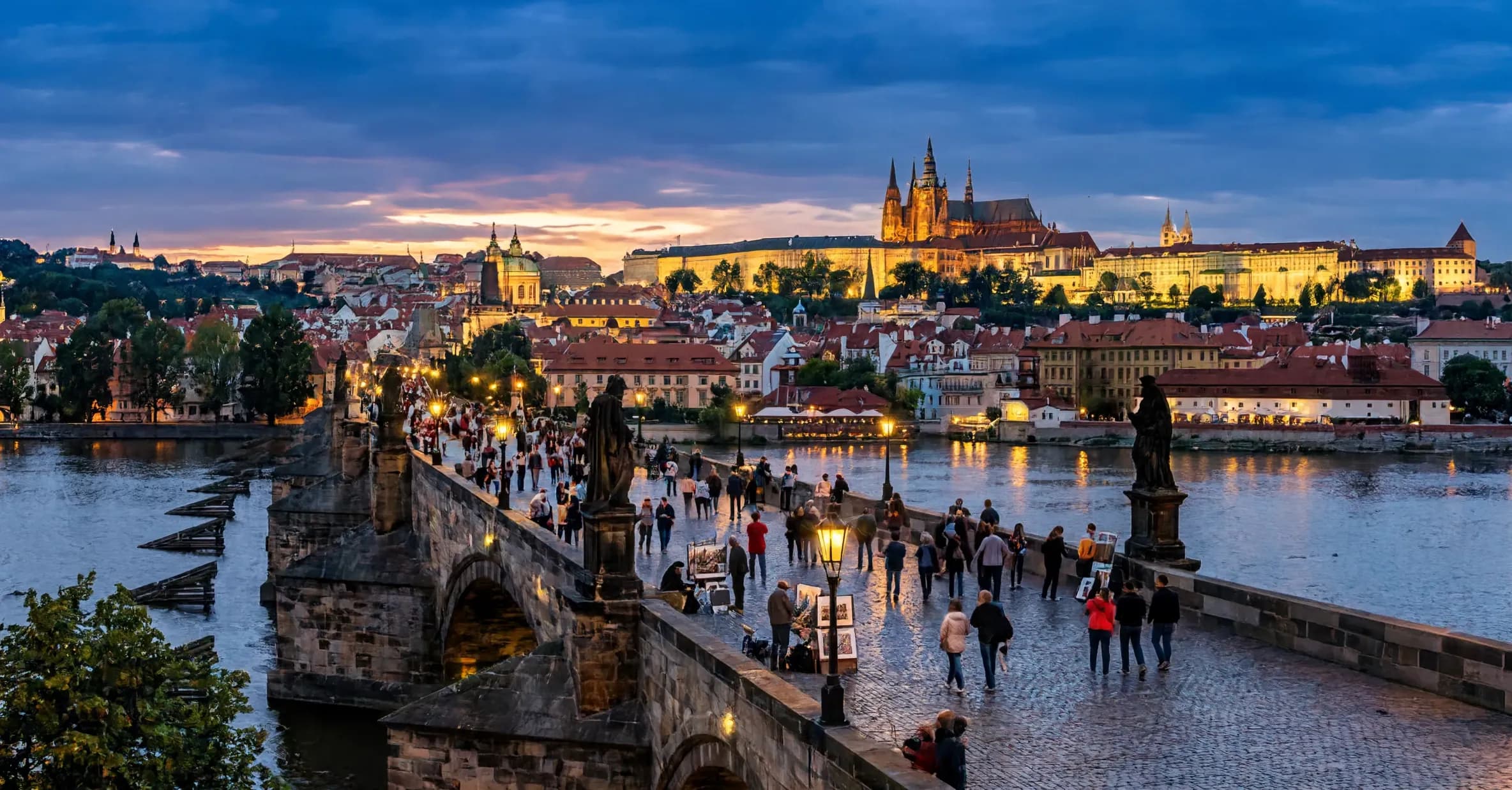 Charles Bridge, Vltava River and Prague Castle at dusk